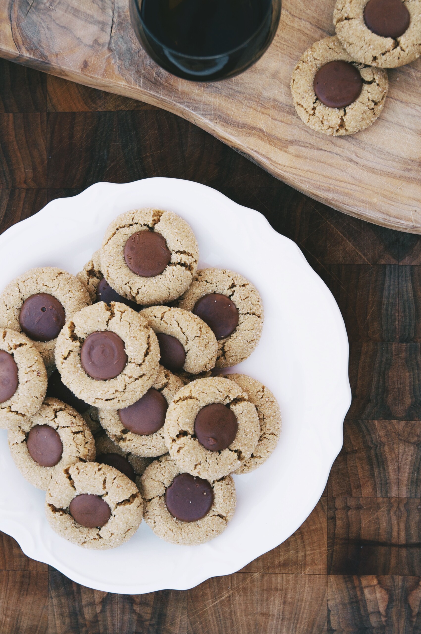 sparkling almond butter and chocolate cookies on a plate and on a cutting board