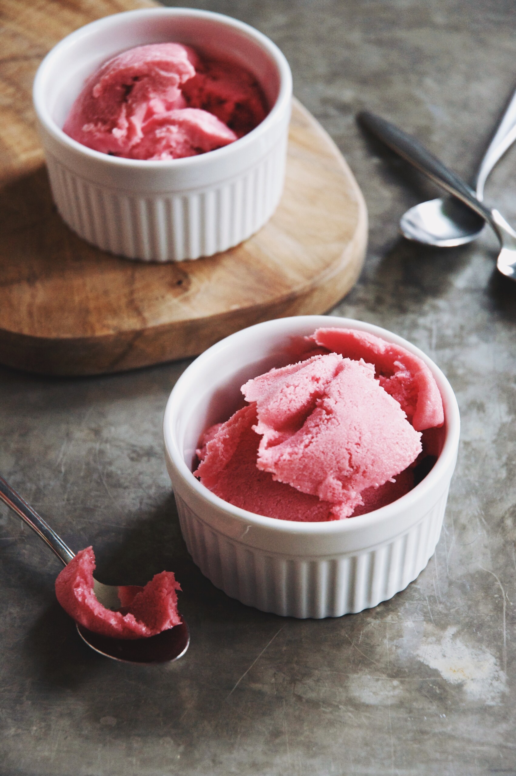 two bowls of sherbet on a cutting board